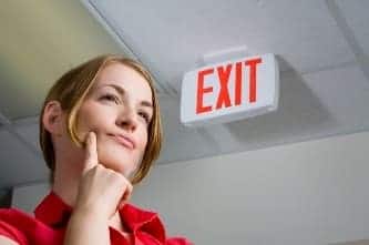Woman near Exit sign