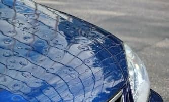 Hail damage on car hood