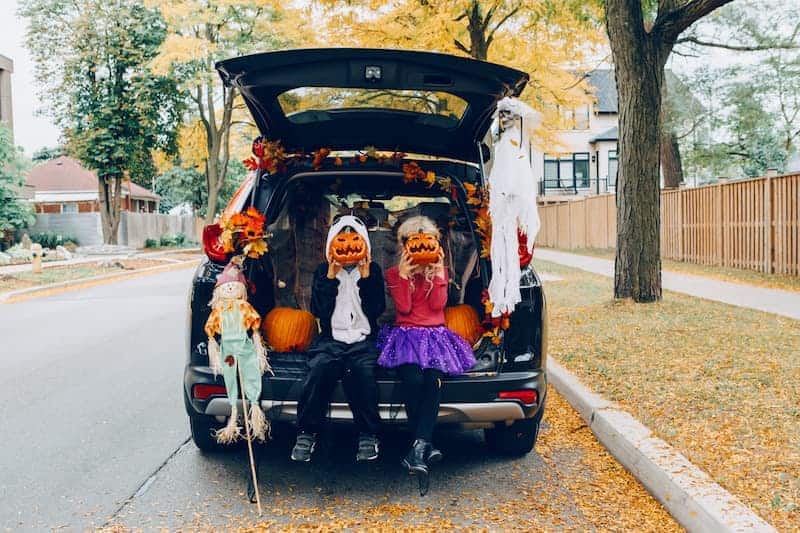 Halloween costumed kids in hatchback 