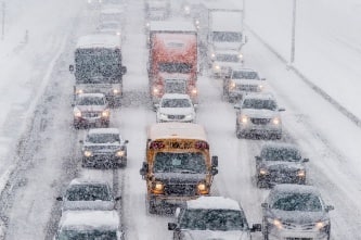 Cars driving in snow on highway