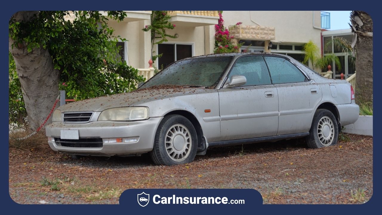 Abandoned car parked on roadside